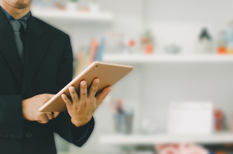 businessman holding a tablet to search for information and do business online.